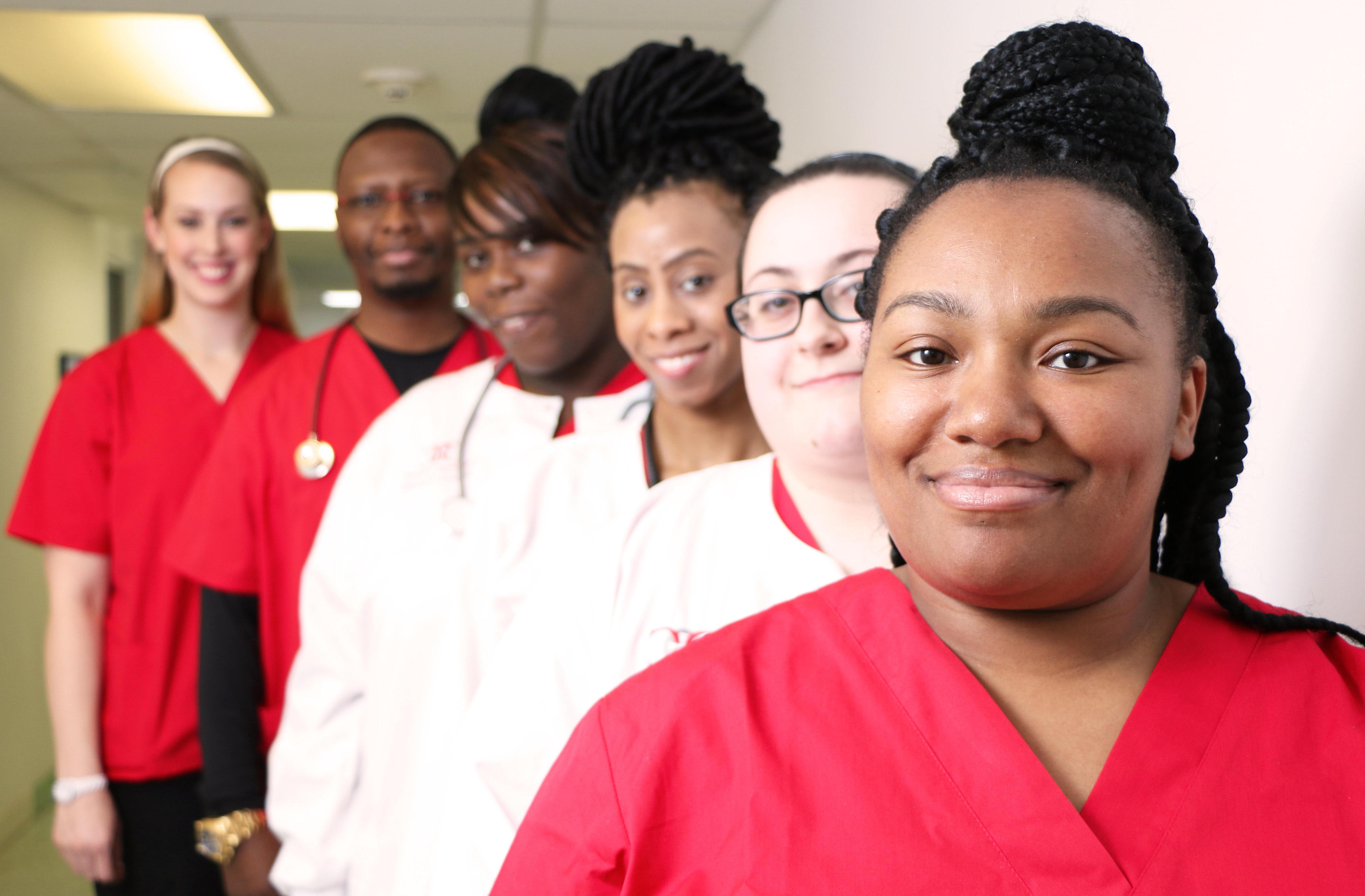 Nursing Program. Students in nursing program. Diverse, affordable. CNA. PN. RN. Registered Nurse, Practical Nurse, Certified Nurse Aide. Pass rate. Donnelly College in Kansas City, Kansas. Certificate and Degree. Associate degree and Bachelor's degrees pathways. 